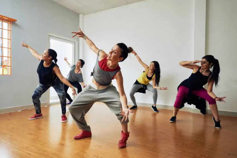Some adults practice Zumba moves.